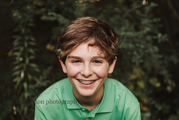 portrait of a happy teen boy by monica carlson photography