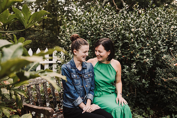 mother and daughter giggling in the garden at Bulloch hall