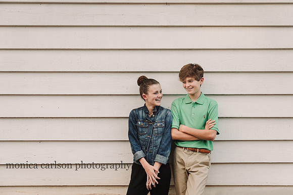 teen siblings laughing together during a photo session