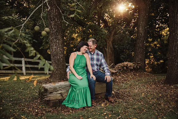 romantic portrait of a married couple sitting in a bench by monica carlson photography