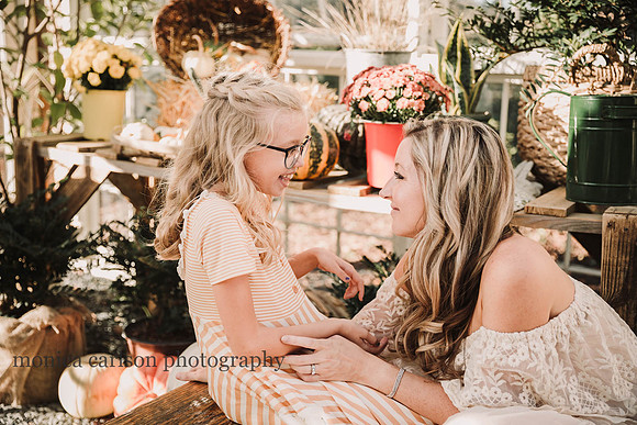 mother and daughter sweetly giggle together during their photo session in Lawrencevillie, GA