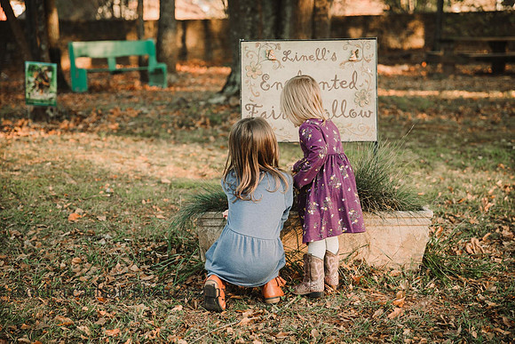 two girls looking linell's enchanted fairy hollow