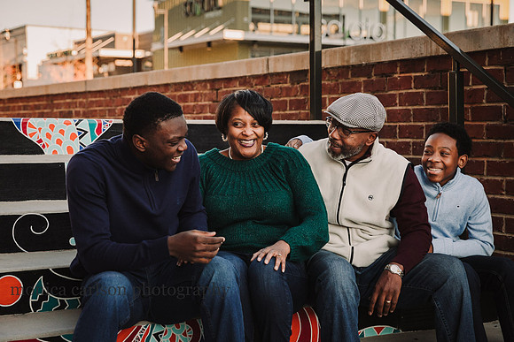 family of four laughing together at Halcyon Forsyth