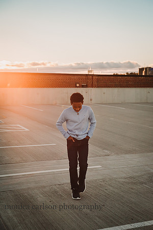 teen boy taking a walk at the Halcyon parking lor roof