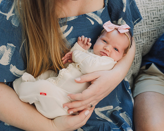 newborn baby in mothers arms