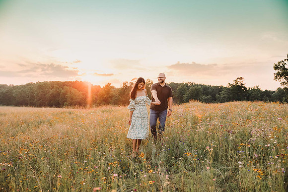 Couple walking on a wildflower field