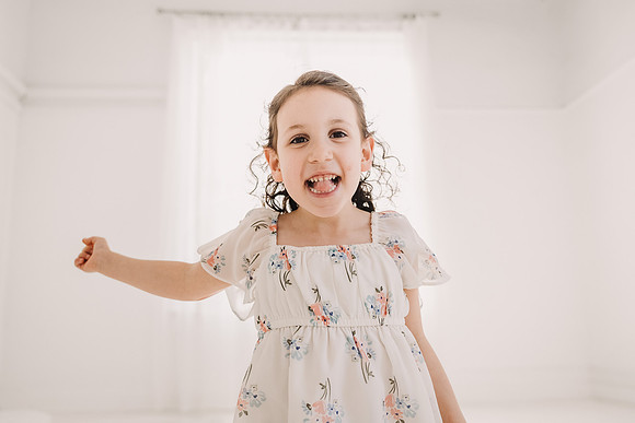 pre school girl make a funny face during a studio photo session