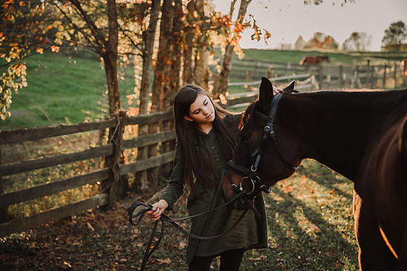 girl looking at her horse
