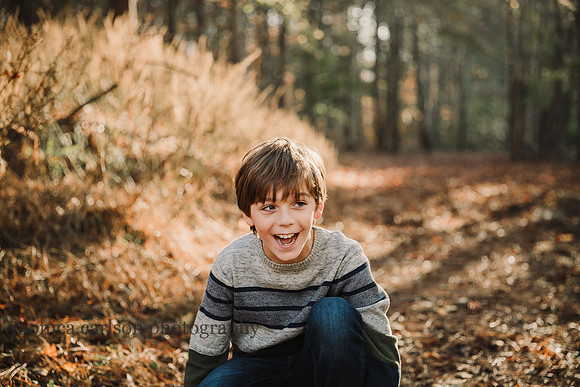tween boy laughing in a farm
