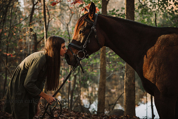 teen girl kisses her horse muzzle