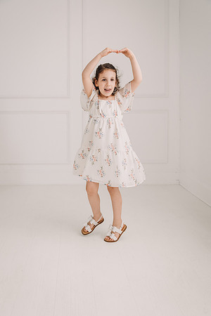 Little girl sticks her tongue out while dancing
